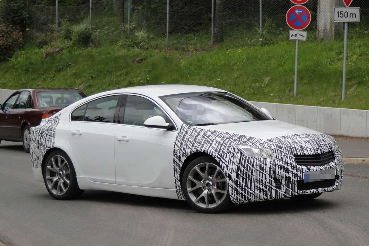 Facelifted Opel Insignia OPC test prototype side-front view_no_copyright