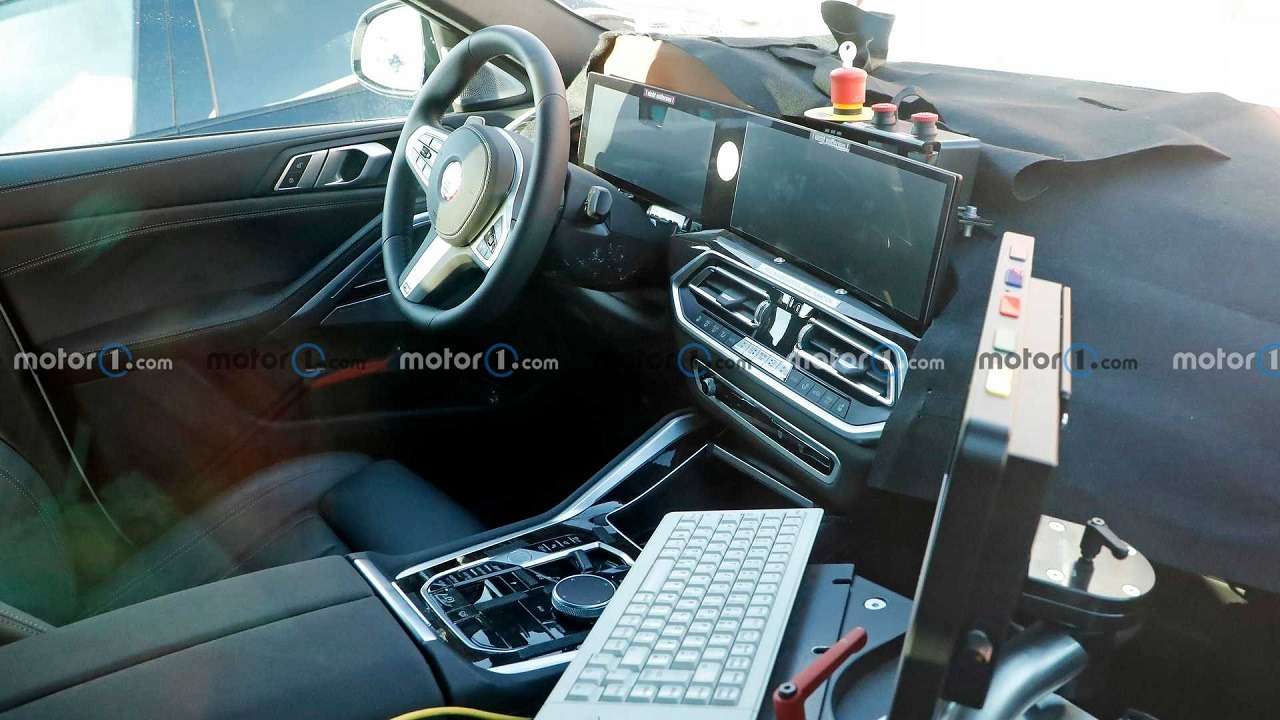 Первые фото рестайлинговой BMW X6: очень длинный экран — фото 1224539